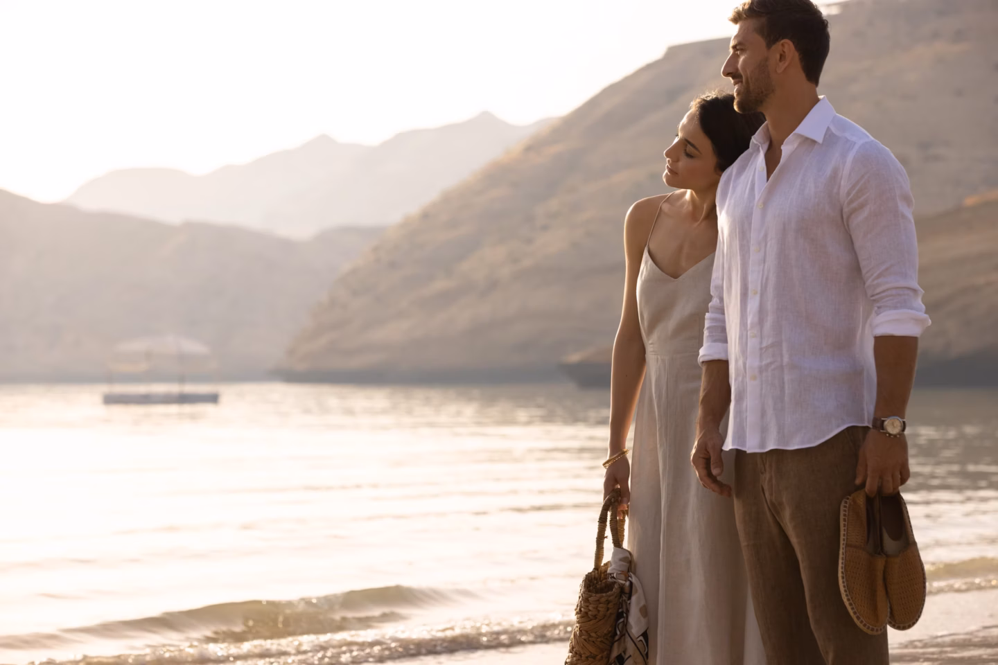 The Jemerieh Muscat Bay Couple walking outside together