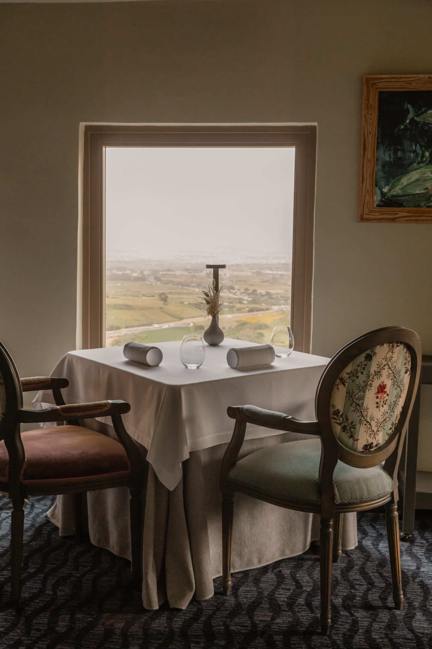 The Xara Palace Relais Chatuea table with view across Malta hillsides